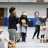  softball and baseball players lead clinic with The Malone Center.